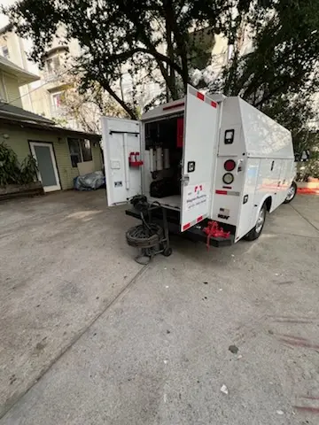 Magnet Plumbing service vehicle on-site for Grease Trap Cleaning in Downtown Hollywood